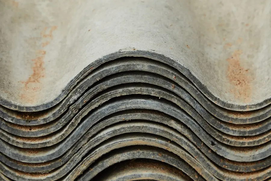 A stack of corrugated fibre cement sheets, the older relative of modern fibre cement roofing slates