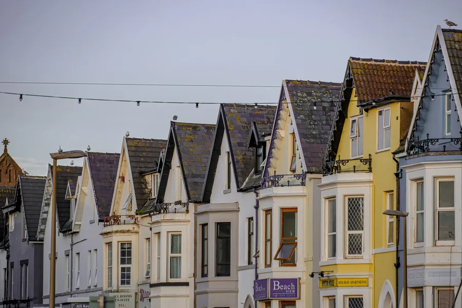 Slate-roofed Victorian seafront terraces of the kind found across Southport, with gulls on the gables