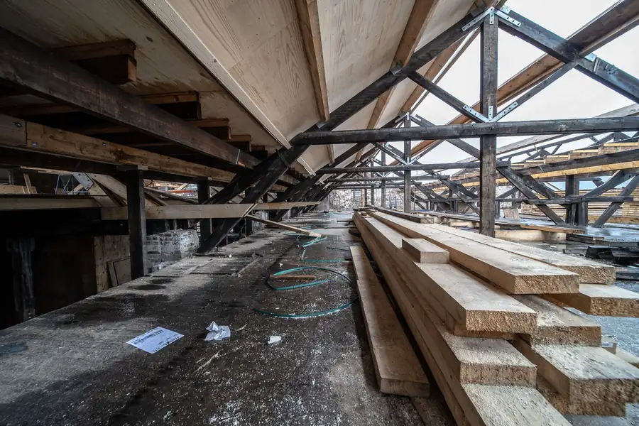 Timber roof structure viewed from inside, showing rafters and purlins of the kind checked before a solar install
