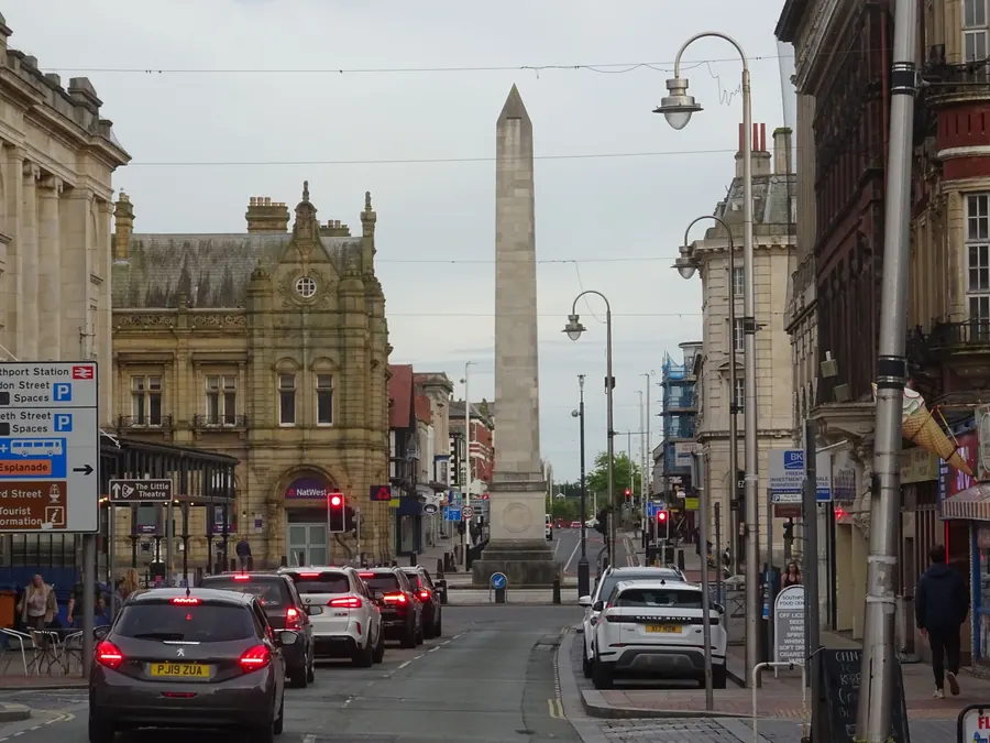 Lord Street in Southport with the war memorial obelisk and Victorian buildings inside the town's conservation area