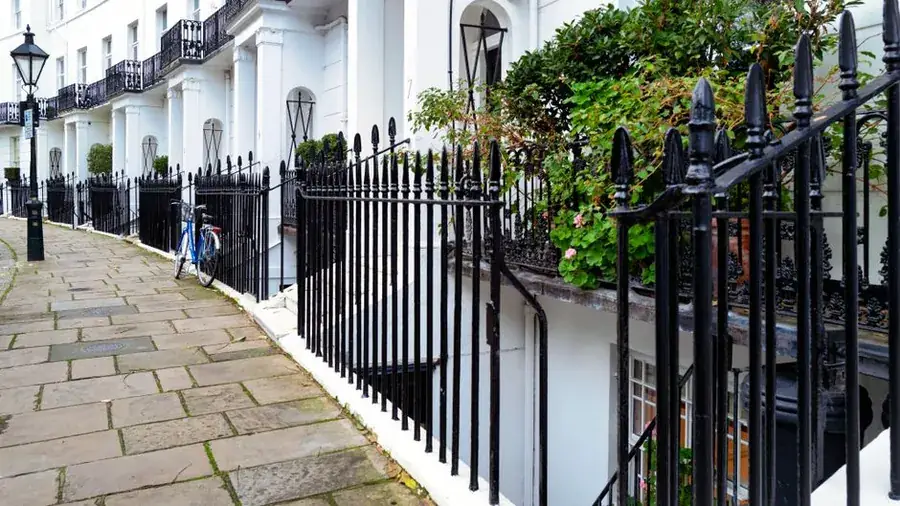 Narrow pavement in front of a terrace, the kind of access constraint that decides how a scaffold is built