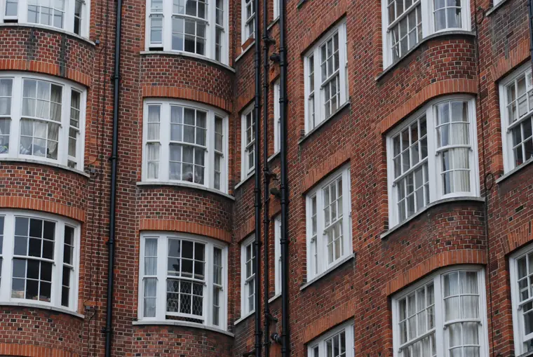 Red brick period frontage with bay windows, the sort of Southport conservation area property where roof window design matters