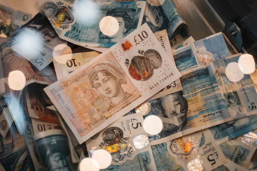 British ten and five pound notes, representing the cost of supplying and fitting a roof window in Southport
