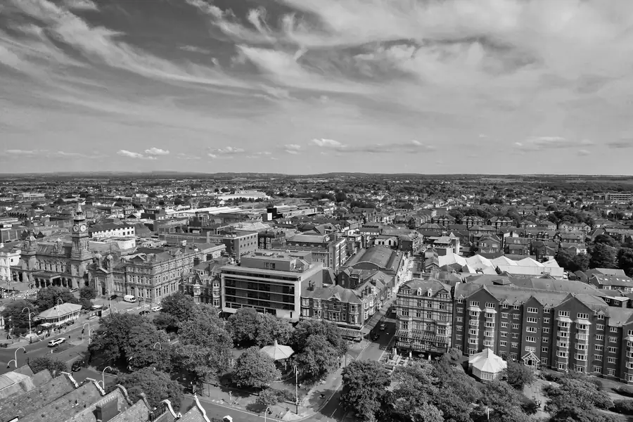 Black and white aerial view over Southport's Victorian rooftops, with gables and valleys between the slate slopes