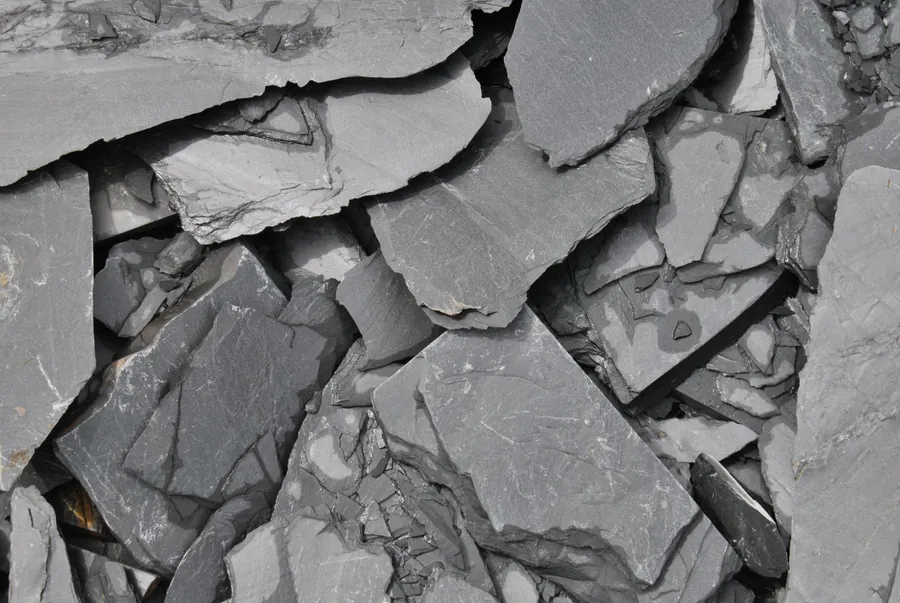 Split natural slate in the raw, the covering whose origin and grade drive the biggest price step on a Southport re-roof