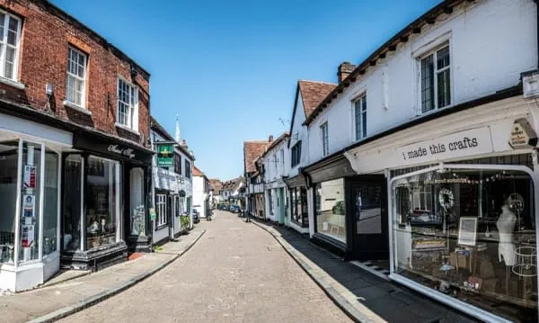 An attractive village shopping street of small independent shops, the kind of scene Birkdale Village is known for