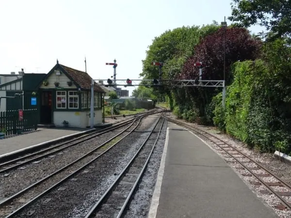 A narrow-gauge heritage railway station with signals and track, as run by volunteers near Banks