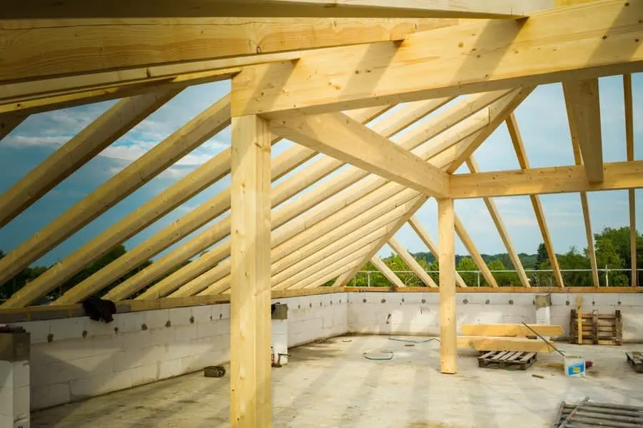Roof timbers and insulation exposed during a re-roof, the work that brings building regulations into play