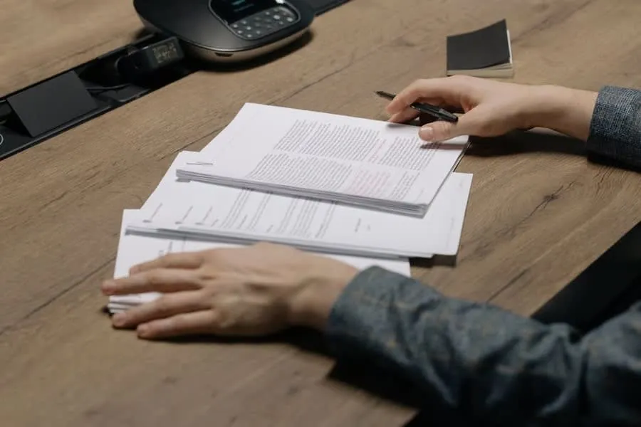 Person reading through a survey report at a table, working out what the roof section means