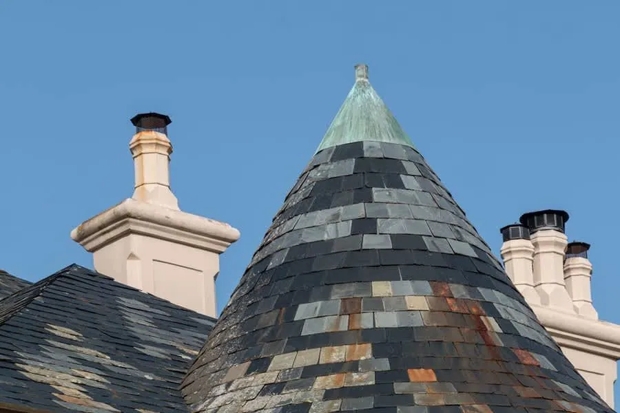Older slate roof with chimney, showing the kind of detail a Southport home survey comments on
