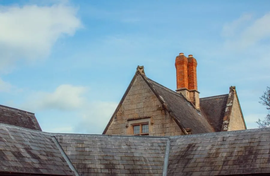 Slate rooftops and chimney pots on English houses