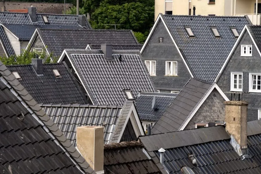 Tiled rooftops viewed from a distance, roughly the vantage point a surveyor has when assessing a roof