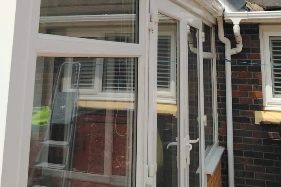 New guttering, downpipe and lead flashing where a lower roof meets the main house in Southport