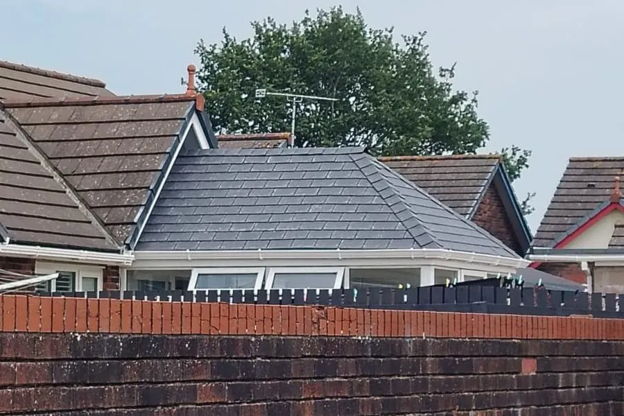 A completed hipped tiled roof and new white fascias on a bungalow in Southport