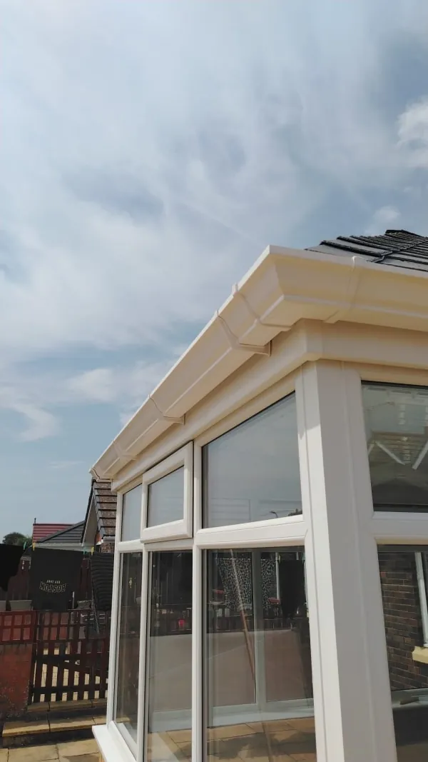 New white fascia, soffit and guttering fitted along a roof edge in Southport