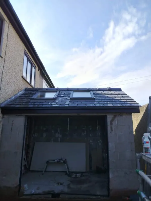 New natural slate roof with two roof windows on a single storey extension in Southport
