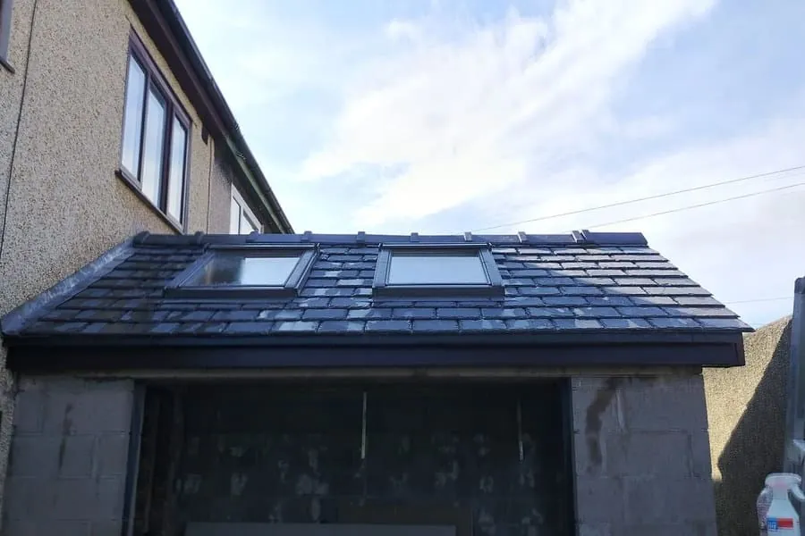 Completed natural slate re-roof with roof windows on a Southport house