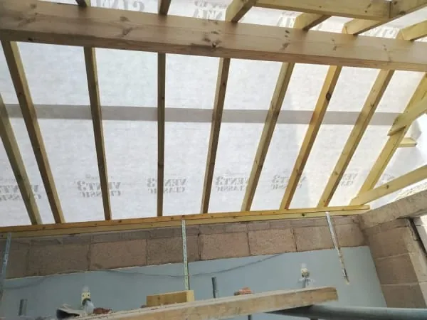 New roof rafters and breathable membrane in place before the covering is laid in Southport