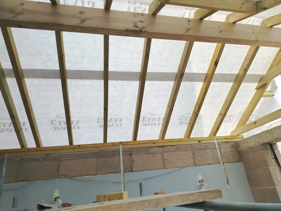 New roof rafters and breathable membrane in place before the covering is laid, on a project in Southport