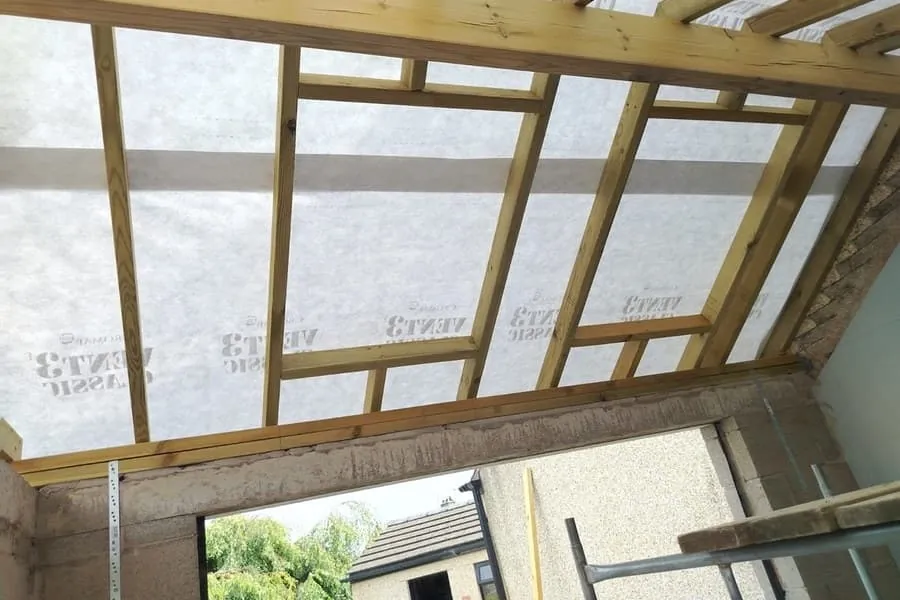 Roof rafters and breather membrane exposed during roof work on a Southport property