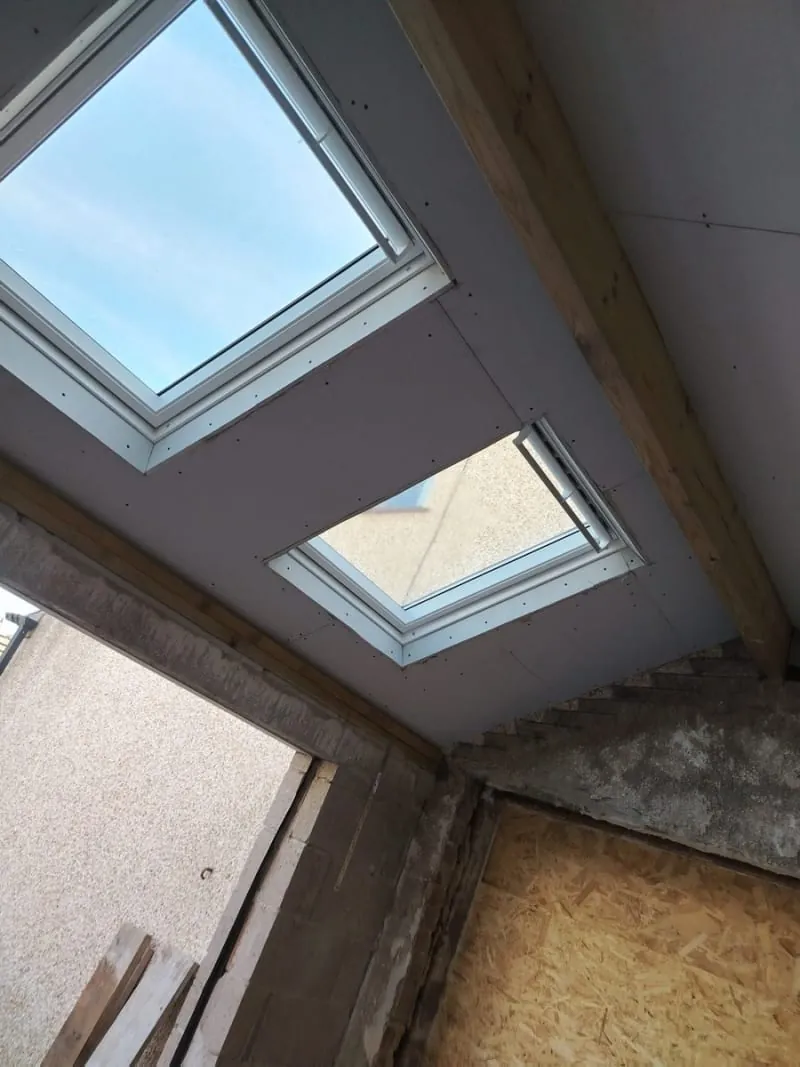Roof windows installed in a vaulted plasterboarded ceiling in Southport