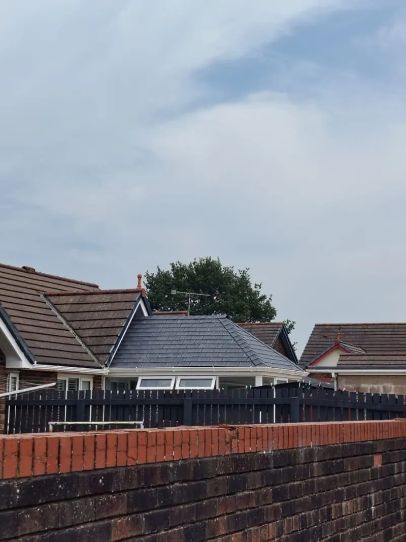 Solid tiled conservatory roof seen from the garden of a Southport bungalow