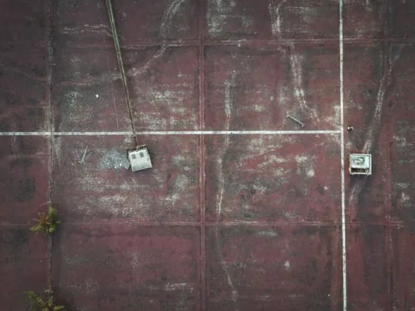 An aged flat roof surface showing silt and wear, like Maghull's original felt garage roofs