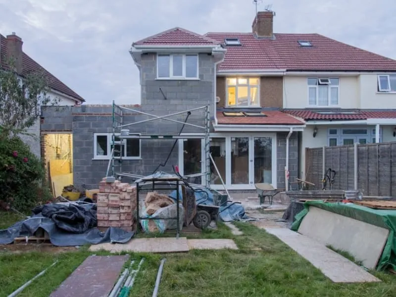 A house under scaffold while emergency roof repair work is carried out